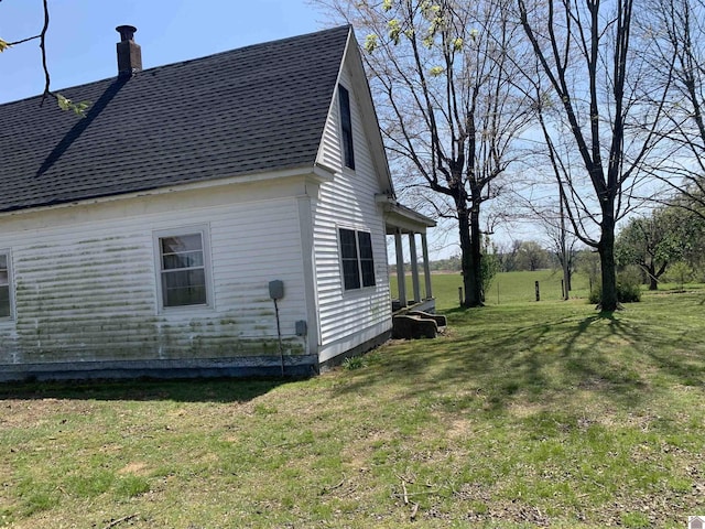 1368 Pritchard Rd, Wingo, KY 42088 - view of side of property with a lawn, a shingled roof, and a chimney