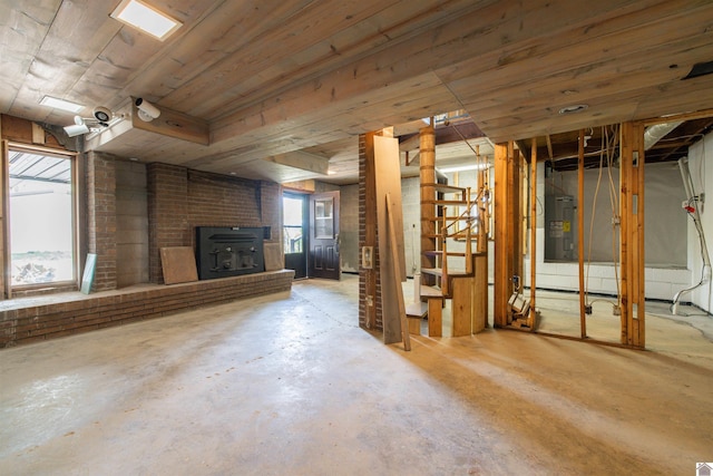 below grade area with electric water heater and stairway