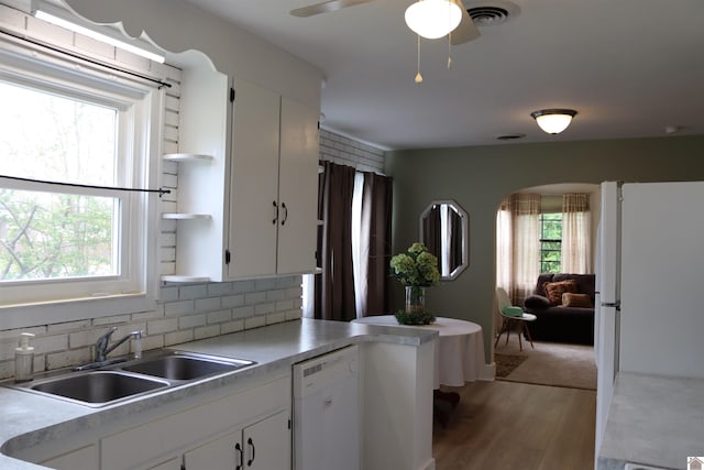 316 S 13th St, Murray, KY 42071 - kitchen with a sink, white appliances, arched walkways, light wood-style flooring, and visible vents