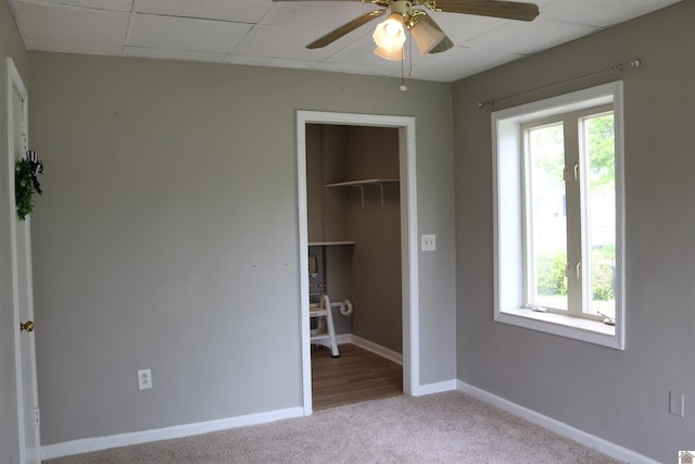 316 S 13th St, Murray, KY 42071 - unfurnished bedroom with a closet, carpet flooring, baseboards, and multiple windows
