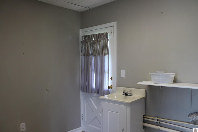 316 S 13th St, Murray, KY 42071 - bathroom featuring baseboards and a sink