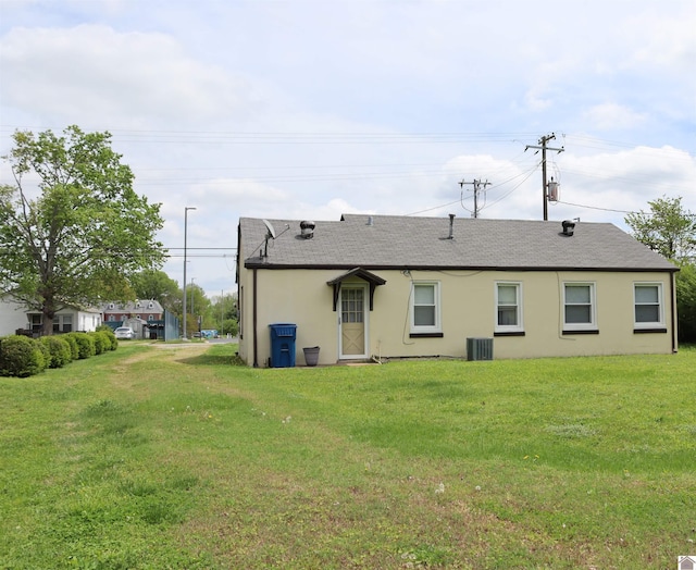 316 S 13th St, Murray, KY 42071 - back of house with a lawn, roof with shingles, and stucco siding