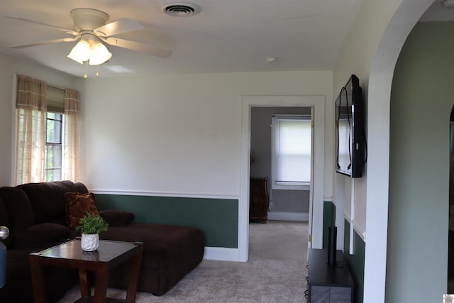 316 S 13th St, Murray, KY 42071 - carpeted living room with ceiling fan, arched walkways, a healthy amount of sunlight, and visible vents