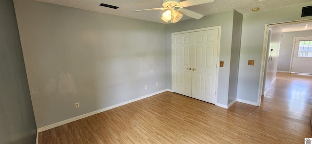 178 Tice, Mayfield, KY 42066 - unfurnished bedroom featuring baseboards, visible vents, and light wood-style flooring