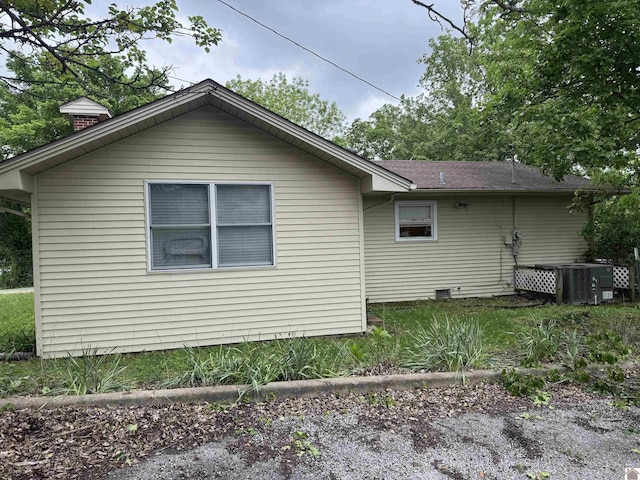 7171/2 Poplar St, Murray, KY 42071 - view of side of property featuring cooling unit and a chimney