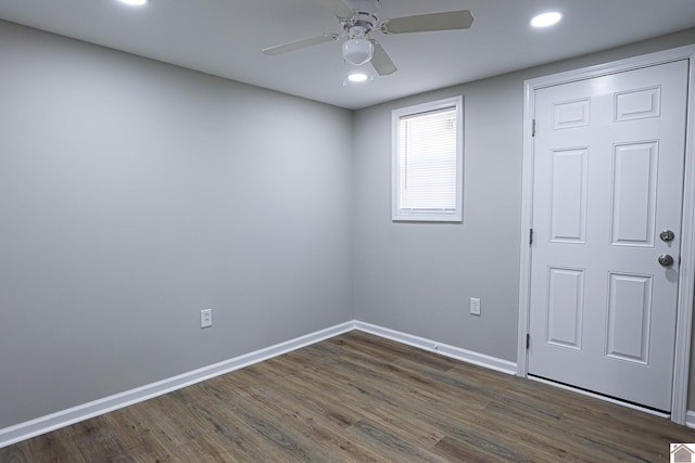 empty room featuring baseboards, recessed lighting, ceiling fan, and dark wood-type flooring