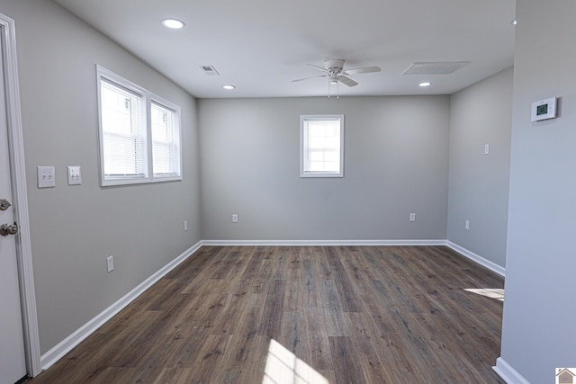 unfurnished room with visible vents, baseboards, recessed lighting, dark wood finished floors, and a ceiling fan