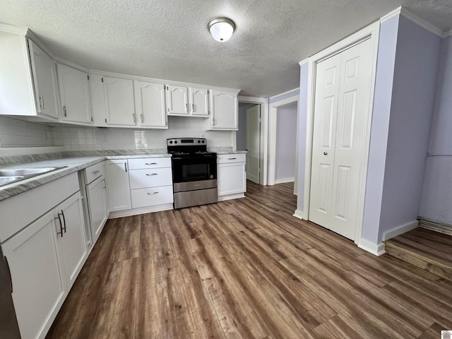 kitchen with electric stove, baseboards, dark wood-style flooring, and white cabinets