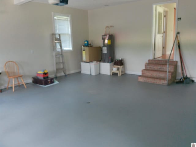 garage featuring a garage door opener and water heater