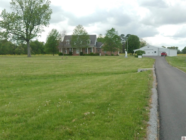 view of front of property with a front yard and a garage