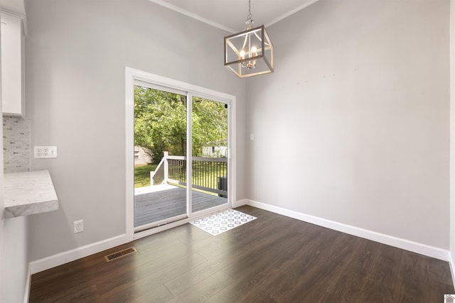 unfurnished dining area with baseboards, visible vents, a chandelier, and dark wood-style floors