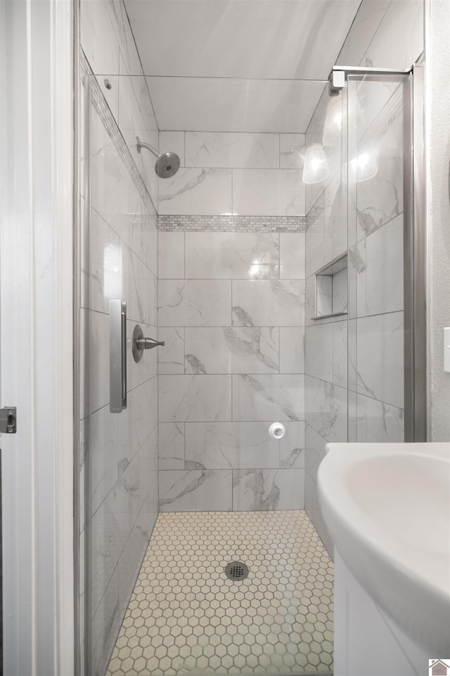 bathroom featuring a shower stall