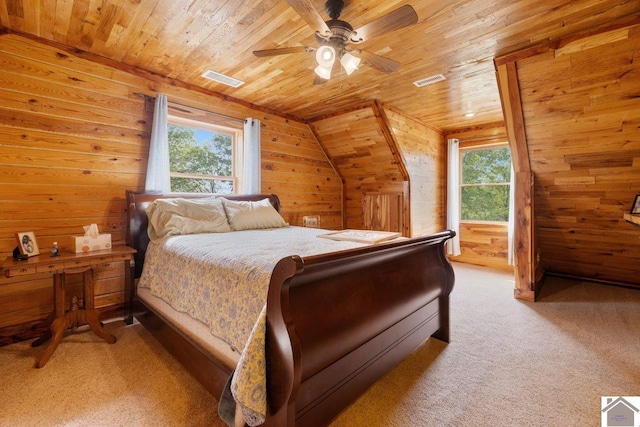 bedroom featuring wooden ceiling, wood walls, and light carpet