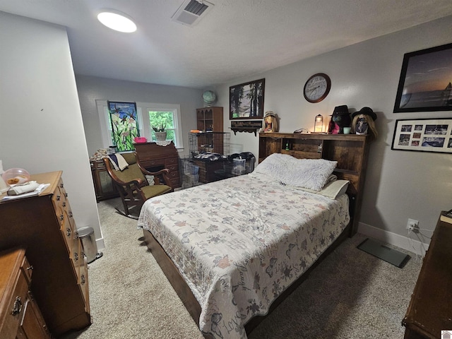 bedroom featuring visible vents, carpet floors, and baseboards