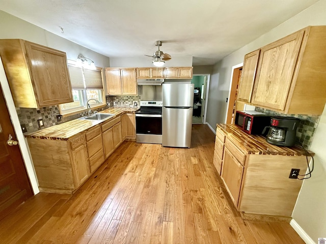 124 Miller Ln, Gilbertsville, KY 42044 - kitchen with light wood-style floors, under cabinet range hood, appliances with stainless steel finishes, ceiling fan, and a sink