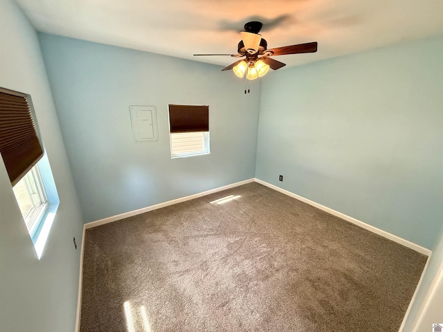 124 Miller Ln, Gilbertsville, KY 42044 - empty room with ceiling fan, plenty of natural light, baseboards, and carpet floors
