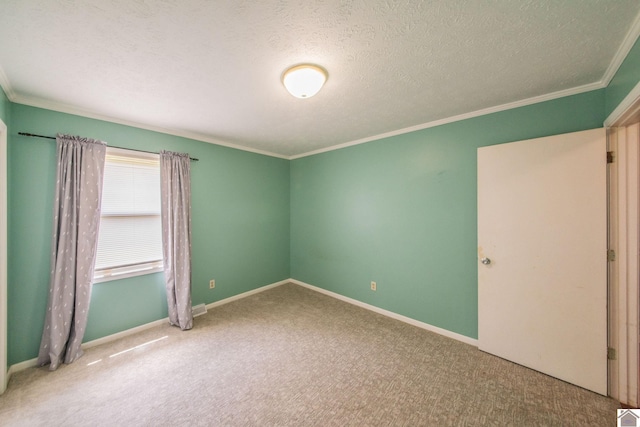 unfurnished bedroom with baseboards, crown molding, a textured ceiling, and carpet flooring