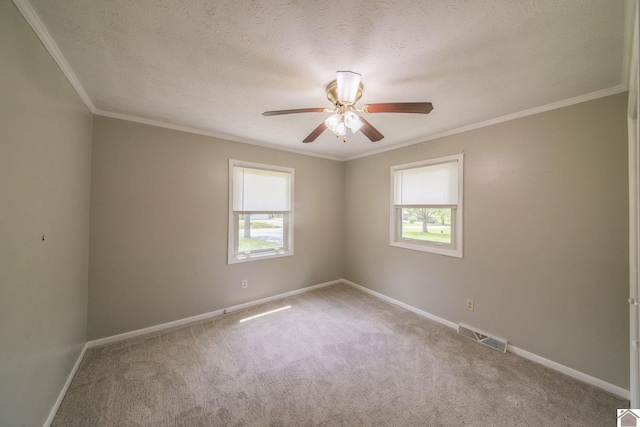 empty room featuring visible vents, a wealth of natural light, and carpet