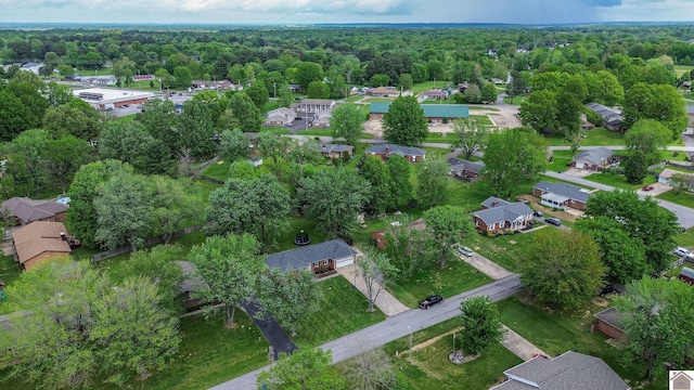 bird's eye view featuring a view of trees and a residential view