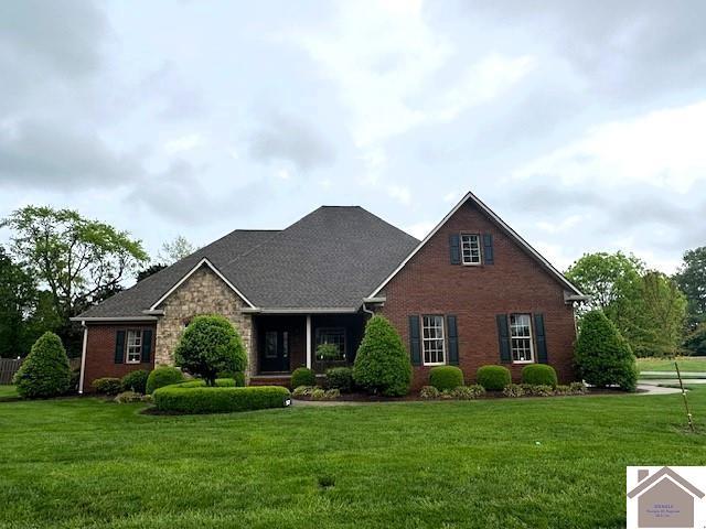 57 Rippling Creek Dr, Murray, KY 42071 - view of front facade featuring brick siding and a front lawn