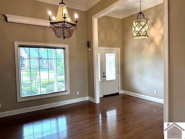 57 Rippling Creek Dr, Murray, KY 42071 - entrance foyer featuring baseboards, a chandelier, and dark wood-type flooring