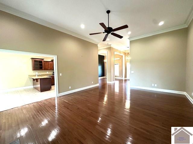 57 Rippling Creek Dr, Murray, KY 42071 - unfurnished living room featuring recessed lighting, ornamental molding, ceiling fan, wood-type flooring, and baseboards