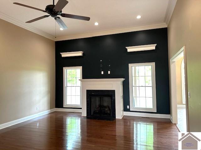 57 Rippling Creek Dr, Murray, KY 42071 - unfurnished living room featuring crown molding, ceiling fan, a fireplace with flush hearth, and wood finished floors