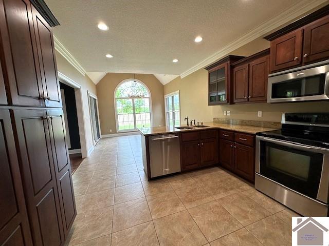 57 Rippling Creek Dr, Murray, KY 42071 - kitchen featuring ornamental molding, a peninsula, appliances with stainless steel finishes, and lofted ceiling