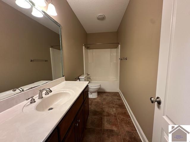 57 Rippling Creek Dr, Murray, KY 42071 - full bathroom featuring tile patterned flooring, toilet, shower / bath combination, vanity, and baseboards