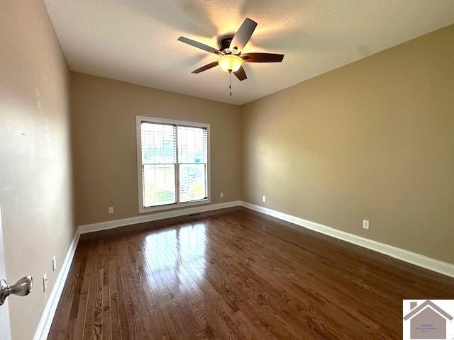 57 Rippling Creek Dr, Murray, KY 42071 - empty room featuring baseboards, a ceiling fan, and dark wood-type flooring