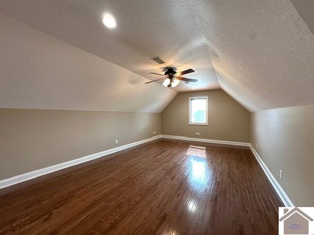 57 Rippling Creek Dr, Murray, KY 42071 - bonus room featuring dark wood finished floors, vaulted ceiling, ceiling fan, baseboards, and visible vents