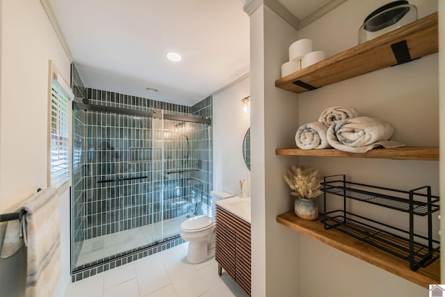 full bathroom featuring tile patterned floors, a shower stall, ornamental molding, toilet, and vanity