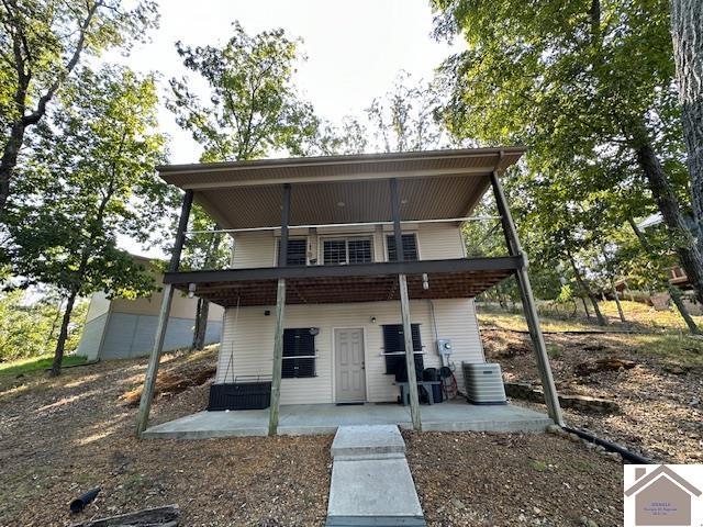 202 Bailey Shore Dr, New Concord, KY 42076 - rear view of house featuring central air condition unit and a patio area