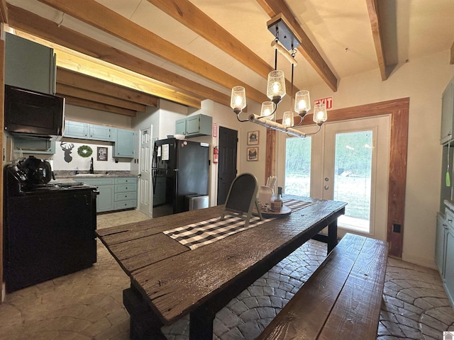 dining room featuring beamed ceiling and a notable chandelier
