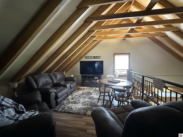 living room featuring wood finished floors and vaulted ceiling