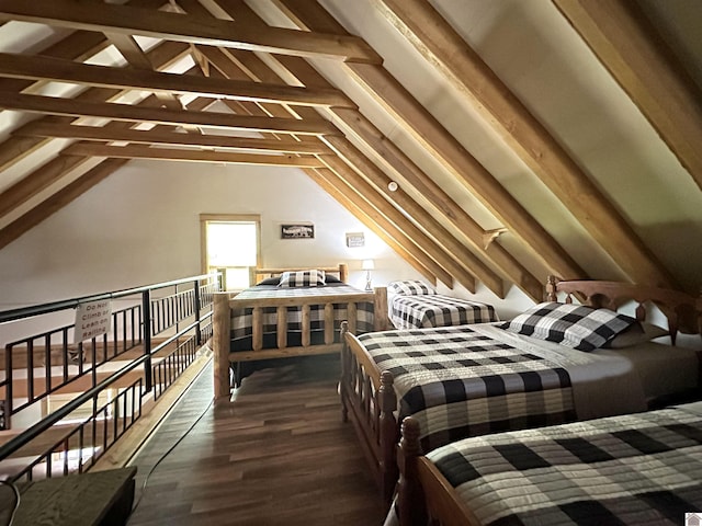 bedroom with dark wood-style floors and vaulted ceiling