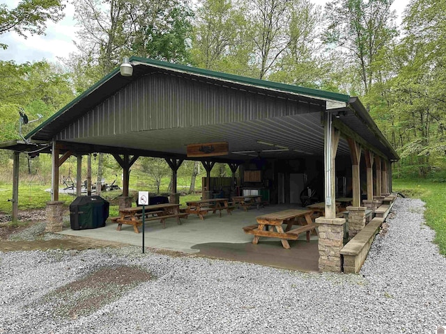 view of property's community with a patio area