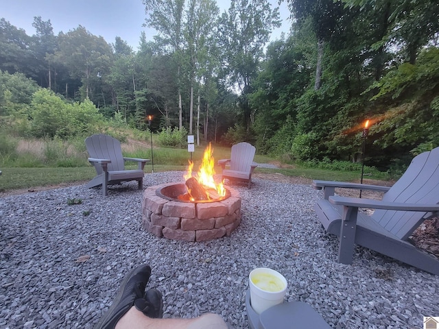 view of yard featuring an outdoor fire pit