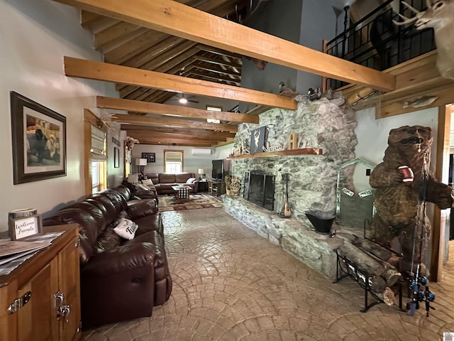 living area with beam ceiling, high vaulted ceiling, and a fireplace