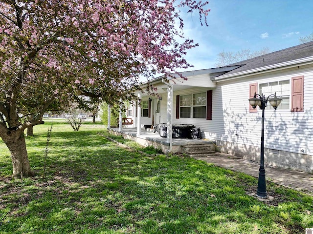 5770 Metropolis Lake Rd, West Paducah, KY 42086 - view of property exterior featuring a lawn and covered porch