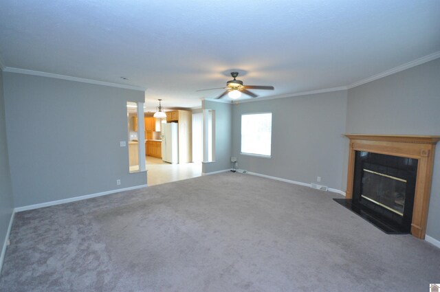 5770 Metropolis Lake Rd, West Paducah, KY 42086 - unfurnished living room with a glass covered fireplace, baseboards, ceiling fan, and ornamental molding