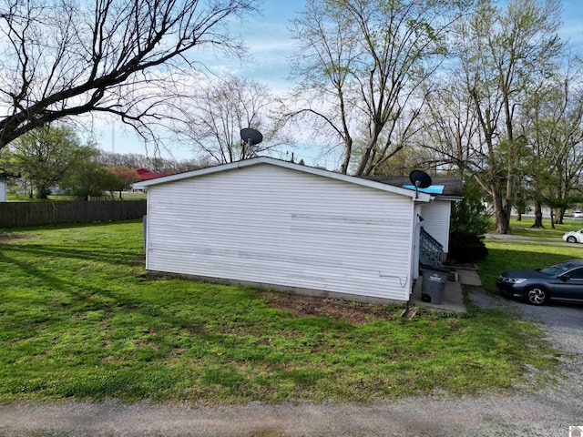 5770 Metropolis Lake Rd, West Paducah, KY 42086 - view of home's exterior with a lawn and fence