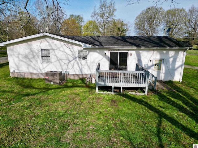 5770 Metropolis Lake Rd, West Paducah, KY 42086 - rear view of house featuring a yard, central AC unit, and a wooden deck