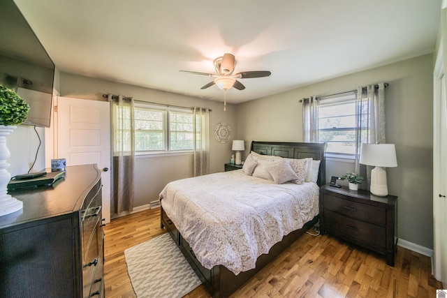 899 Fairview St, Benton, KY 42025 - bedroom with baseboards, ceiling fan, and light wood-style flooring
