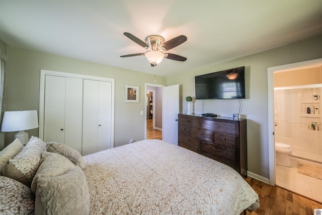 899 Fairview St, Benton, KY 42025 - bedroom with dark wood-style floors, a closet, ceiling fan, ensuite bath, and baseboards