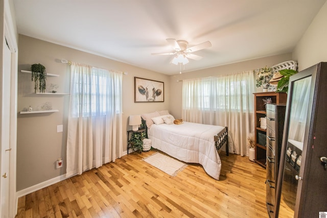 899 Fairview St, Benton, KY 42025 - bedroom featuring a ceiling fan, baseboards, and light wood-type flooring