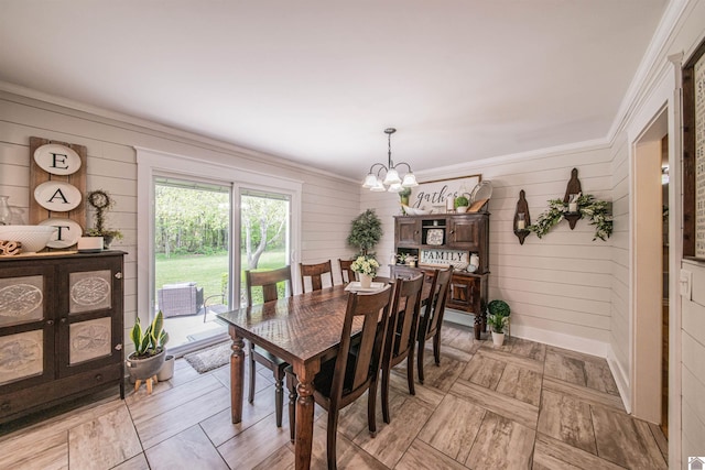 899 Fairview St, Benton, KY 42025 - dining room featuring a chandelier, wood walls, and crown molding