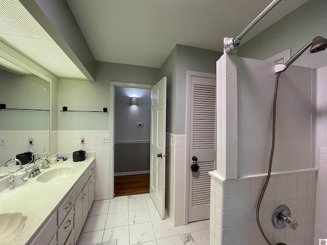 11189 E State Route 94, Murray, KY 42071 - full bathroom with tile walls, a sink, marble finish floor, walk in shower, and wainscoting