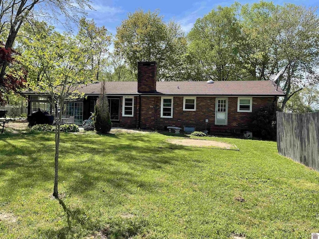11189 E State Route 94, Murray, KY 42071 - back of house featuring a chimney, fence, entry steps, and a lawn