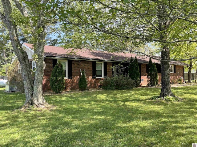 11189 E State Route 94, Murray, KY 42071 - ranch-style house with a front yard and brick siding